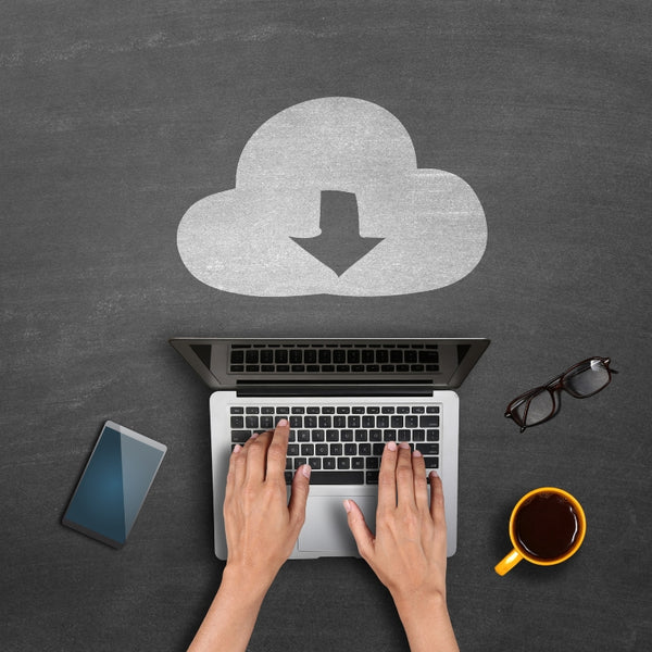Hands on a laptop beneath a chalk-drawn download cloud
