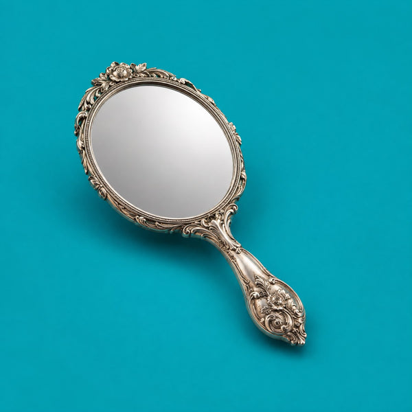 Chilled Bolero - royalty free Latin music track, silver hand mirror cover art by Music Radio Creative